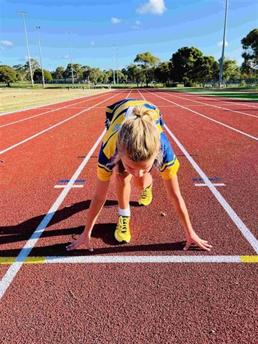 Ballam Park athletics track child ready to run on track