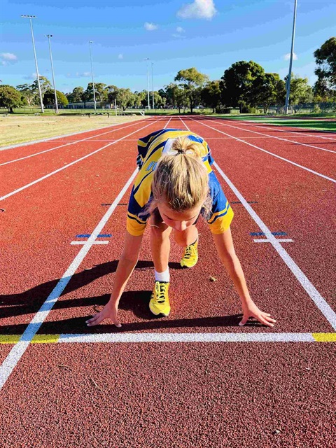 Child ready to run on track