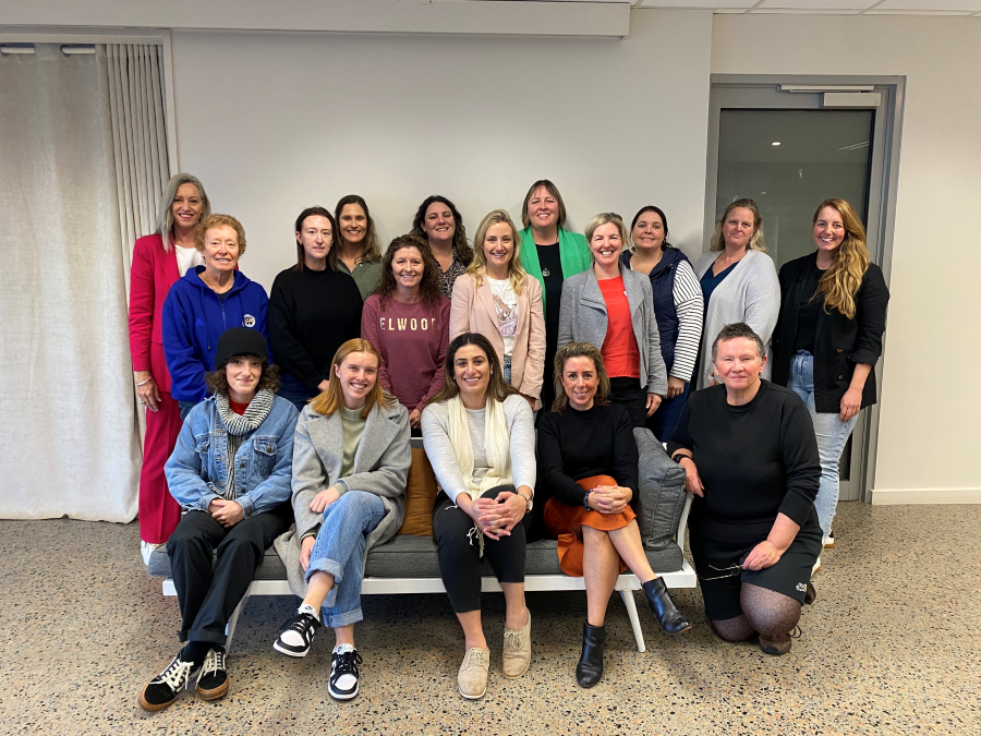 A group of people smiling after taking the Confidence Communication Masterclass