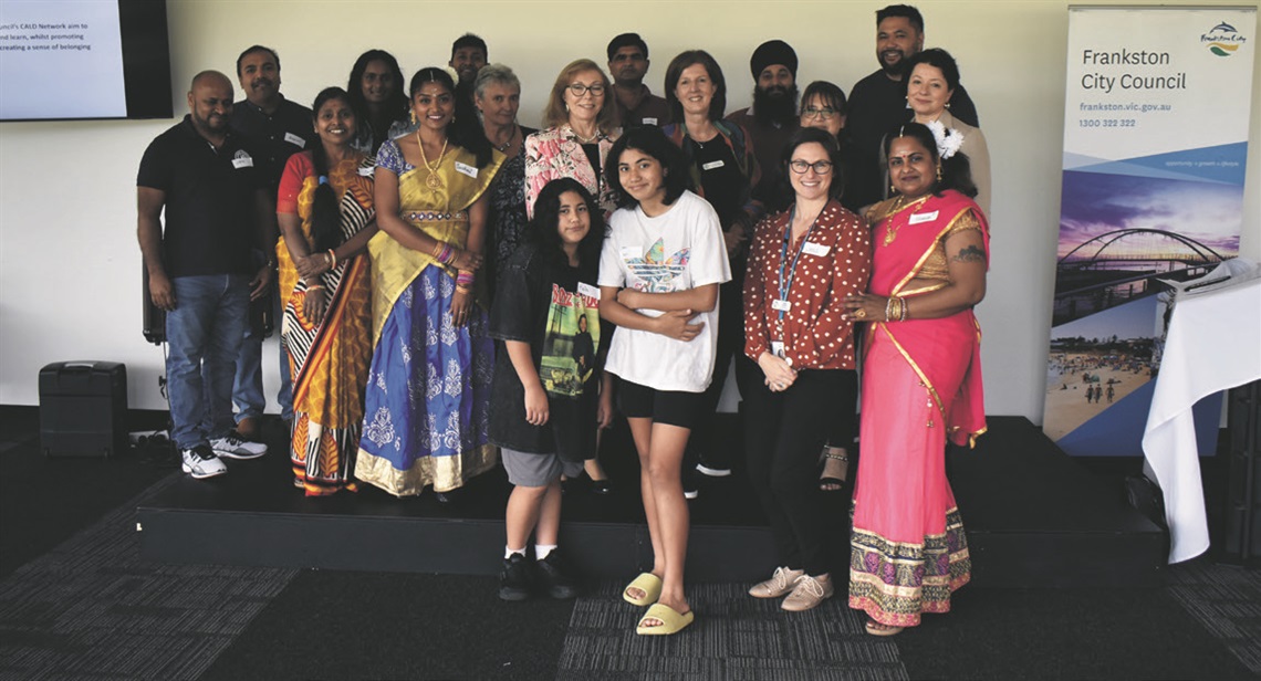 People of various cultures posing for photo