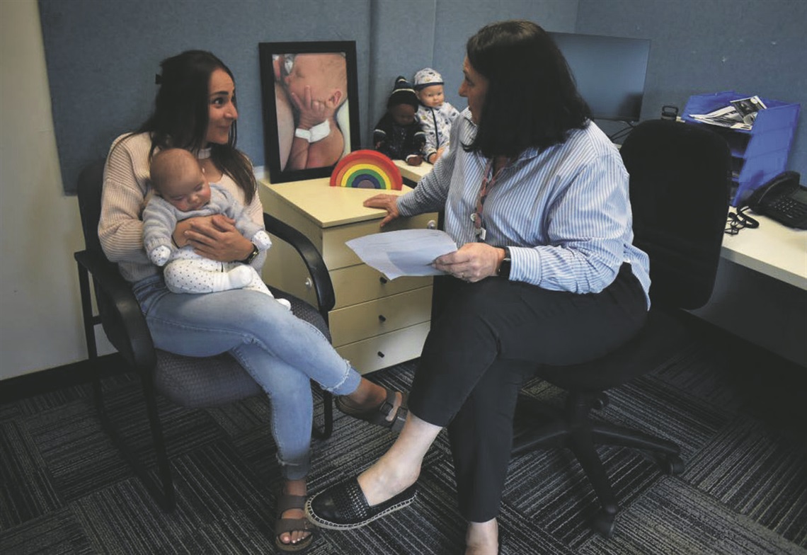 Lily Cannella and her son Leo talking to Melanie McCulloch