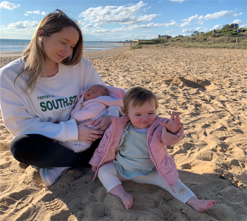 Mother and baby on beach