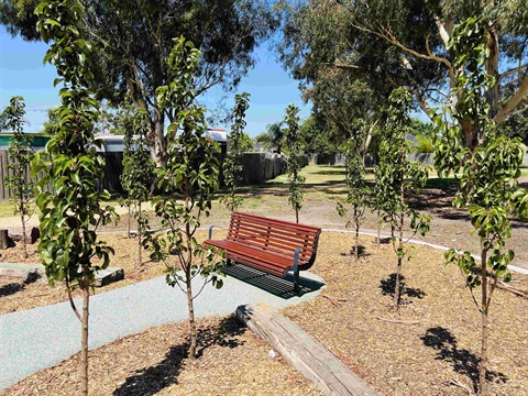 Brolga Reserve - wooden seating bench at playrgound reserve